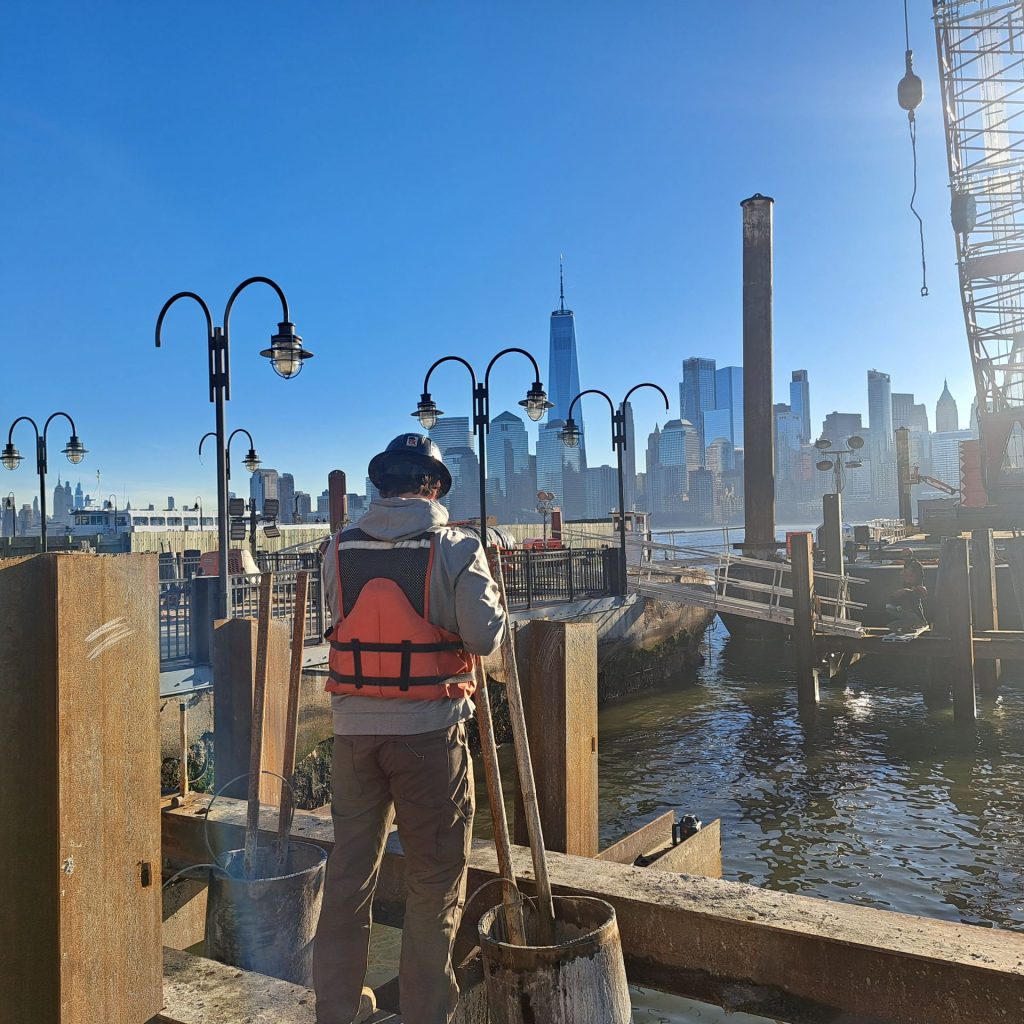 FTG technician overseeing drilled shaft testing at the Liberty State Park waterfront construction site.